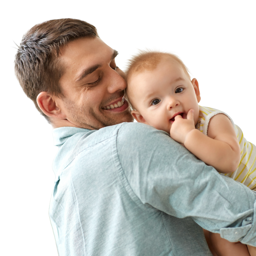 Smiling dad holds baby laying on his shoulder.
