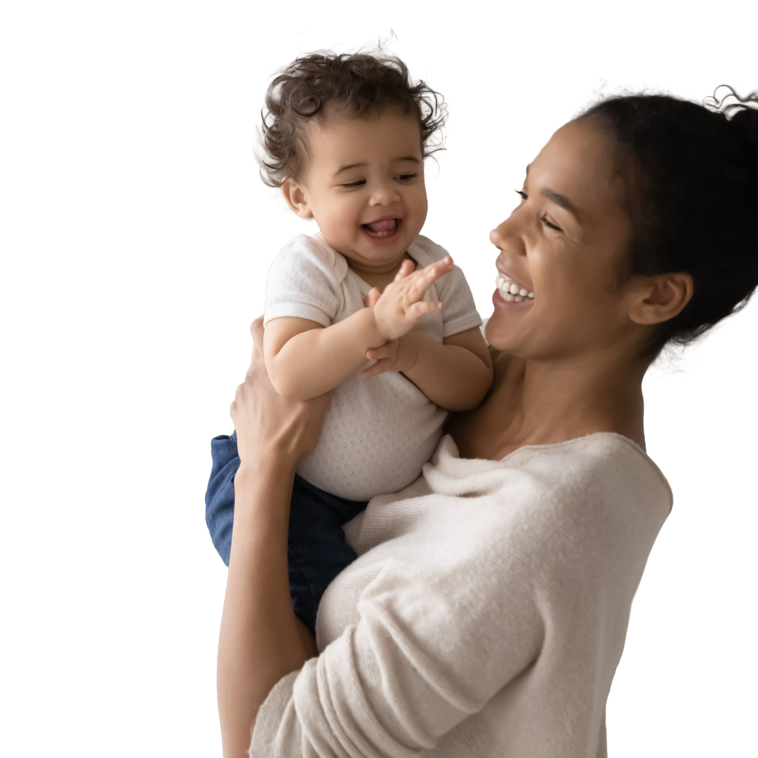 Mom smiles at and lifts clapping baby with two teeth.