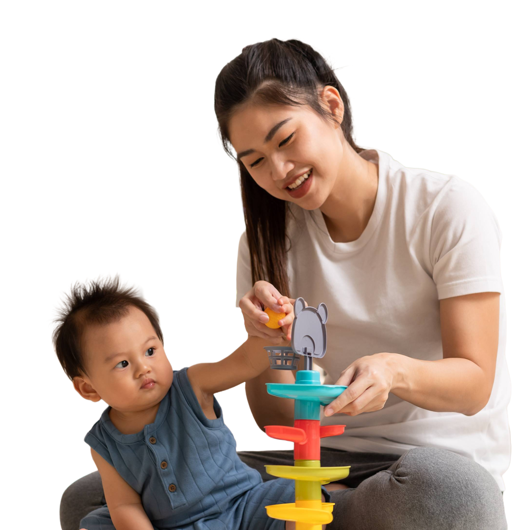 Baby and mother play with colorful spiral, ball tower.